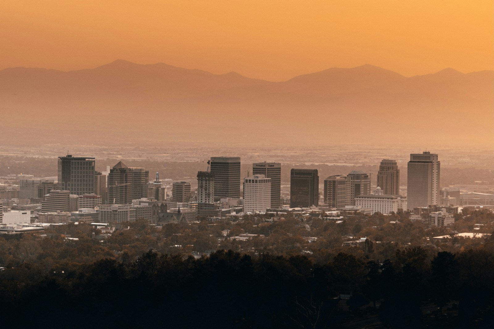 Salt Lake City skyline with mountains behind downtown buildings