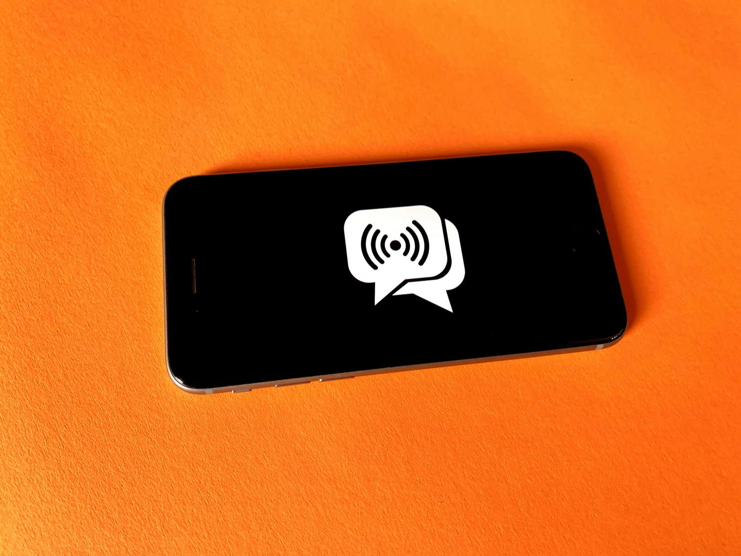Smartphone displaying a contactless communication symbol