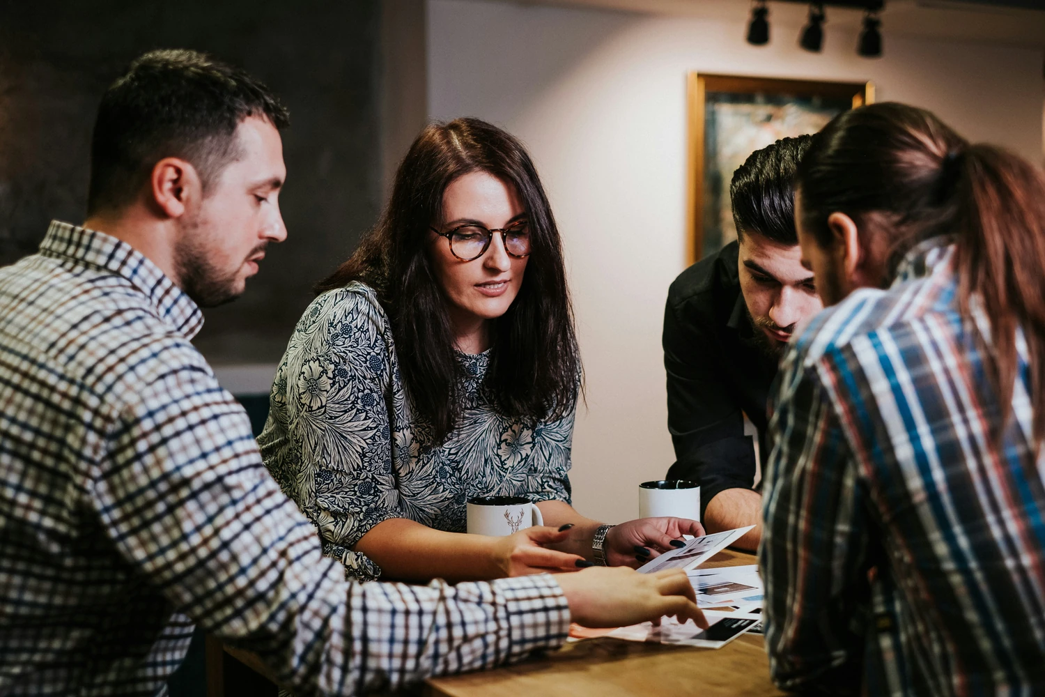 Local team members collaborating around a table
