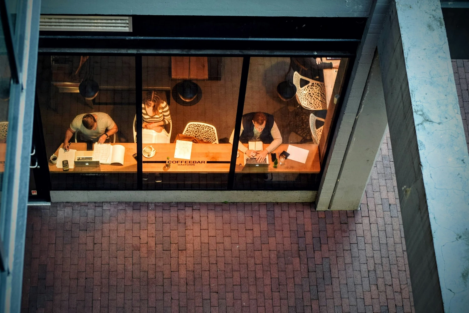 Team meeting visible through an office window