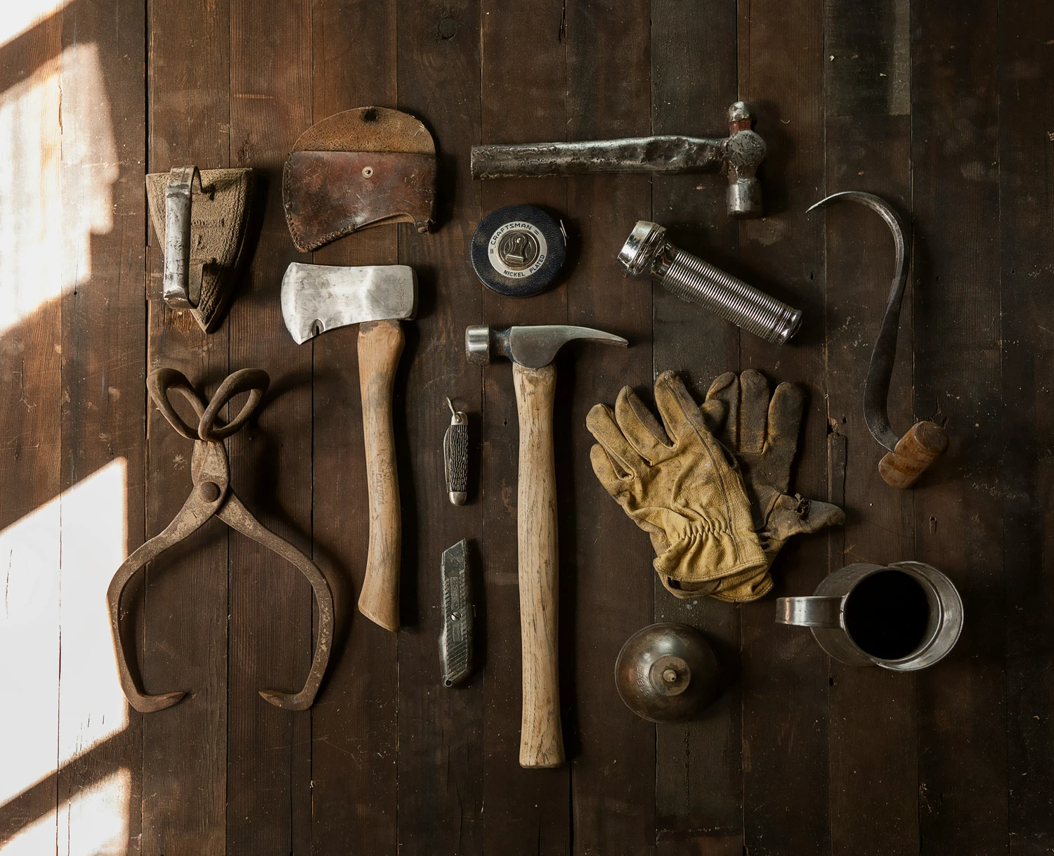 Assorted maintenance tools arranged on a workbench