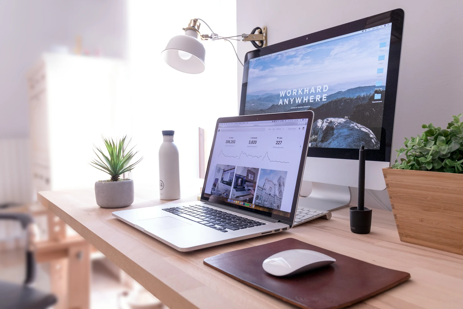 Desktop monitor, laptop, and tablet arranged in a bright workspace